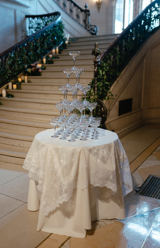 champagne tower setup on the grand staircase during an Armour House wedding in Lake Forest IL